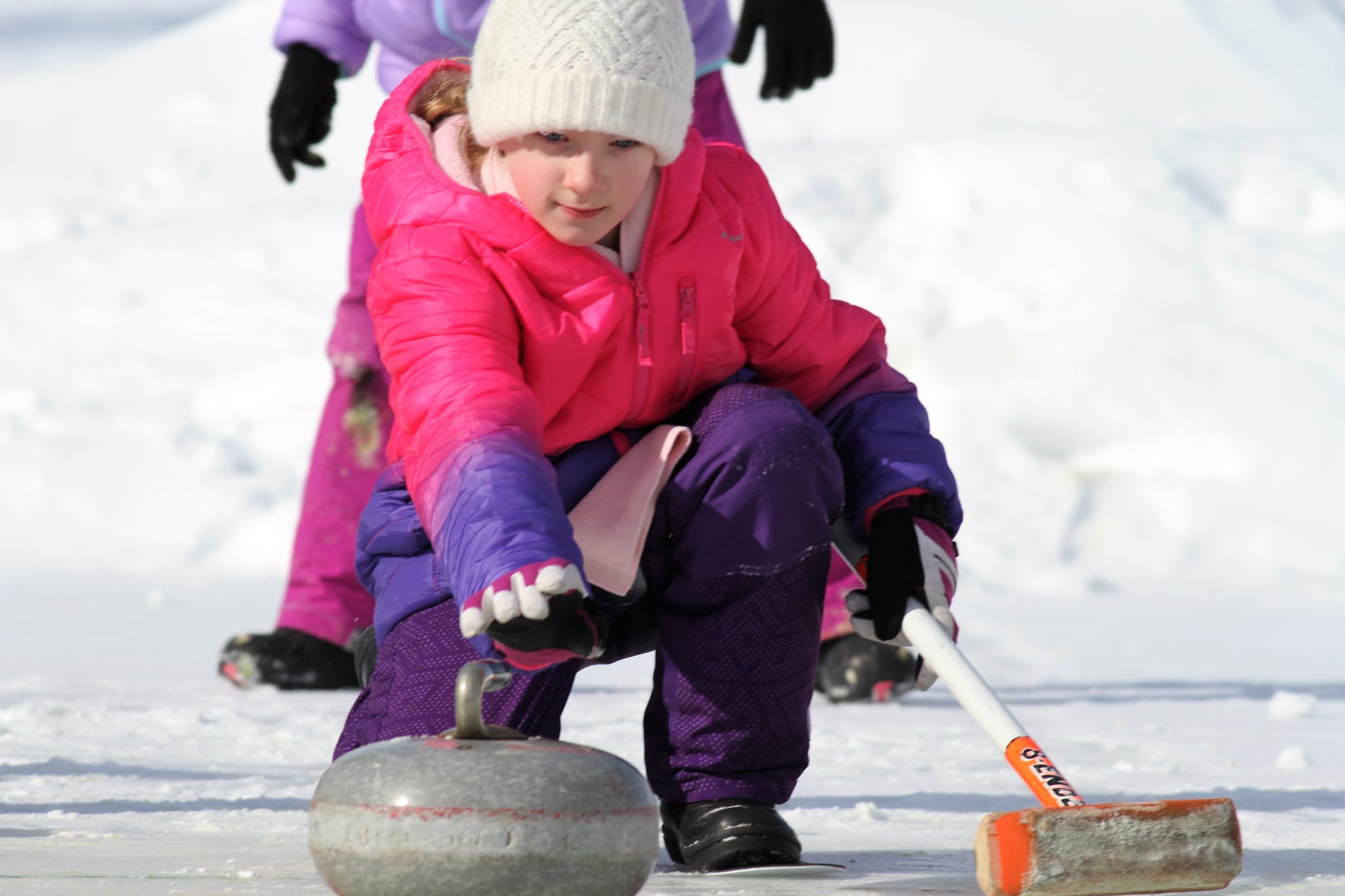 image of a girl crouched down, curling on the lake